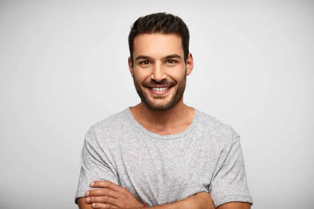 files/smiling-hispanic-man-against-white-background.webp